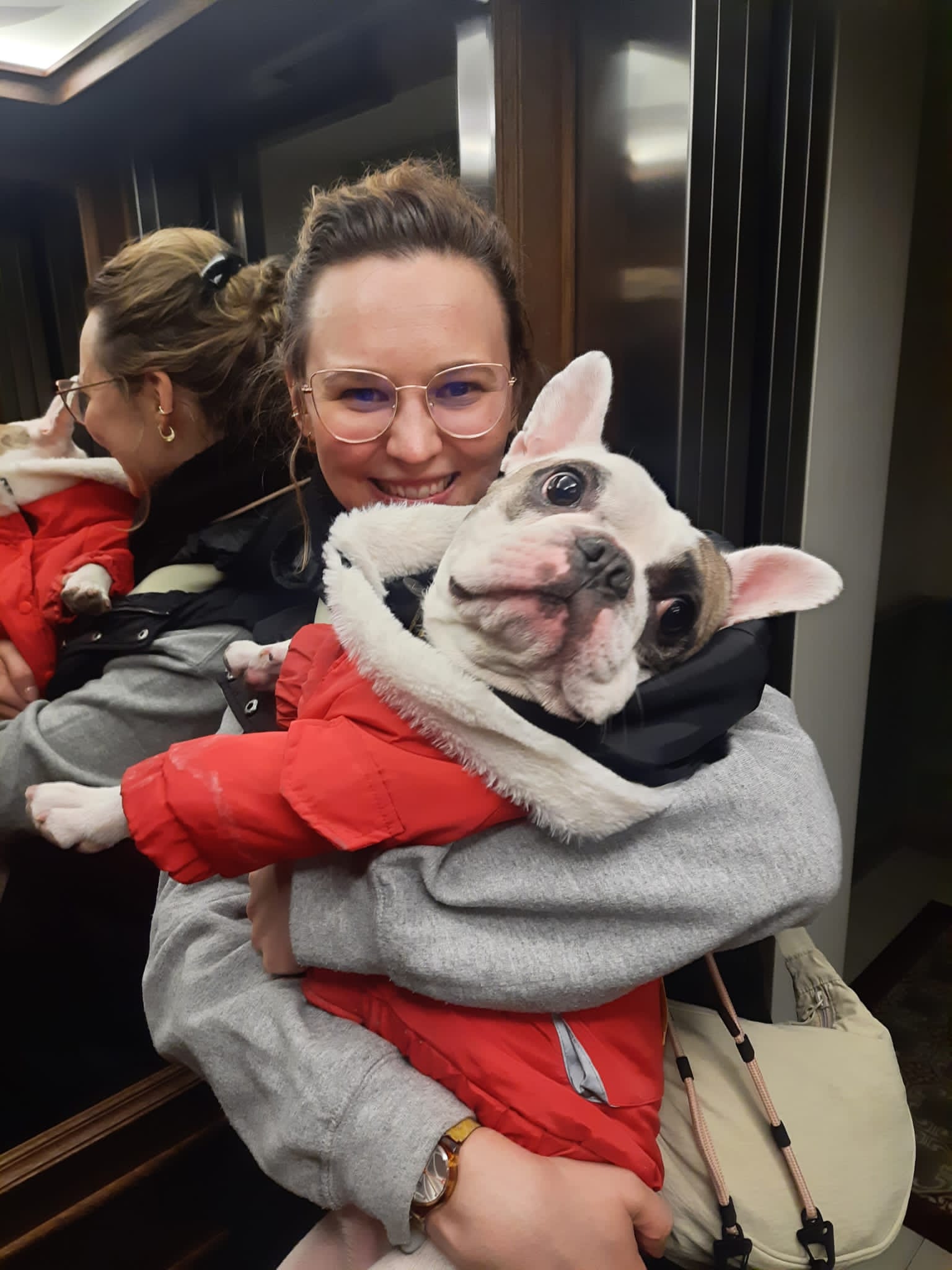 Photo of Nola Chesworth with a french bulldog on her hands.
